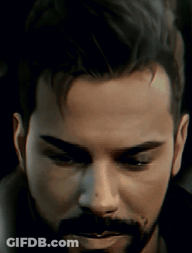 Man With Beard Looking Down GIF