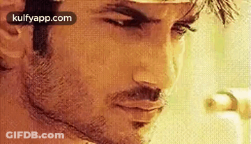 Man With Beard Looking Down GIF