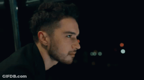 Man With Beard Looking In Dark GIF