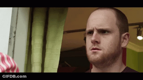 Man With Beard Looking Out Window GIF