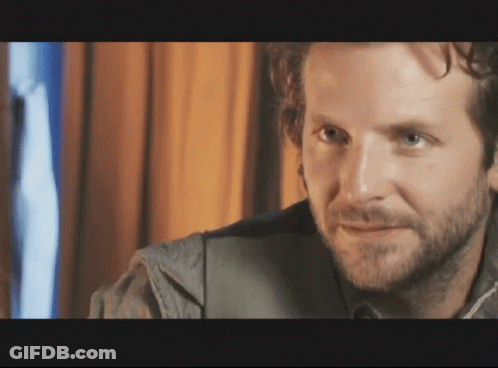 Man With Beard Looks At Camera GIF
