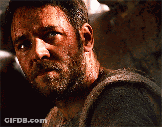 Man With Beard Looks At Camera GIF
