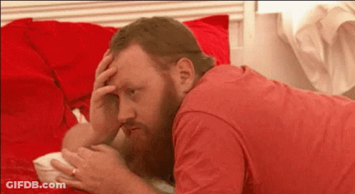 Man With Beard Lying On Bed GIF