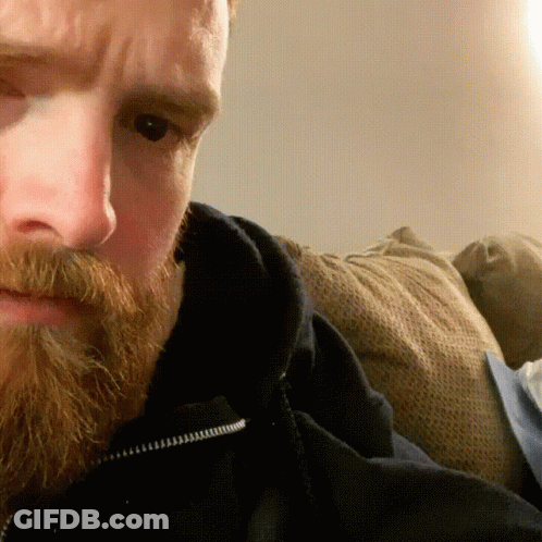 Man With Beard Lying On Couch GIF