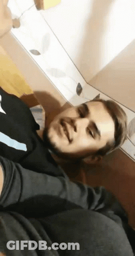 Man With Beard Lying On Floor Eyes Closed GIF