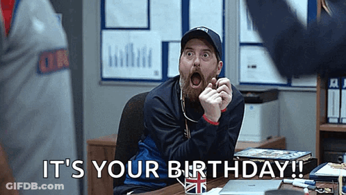 Man With Beard Making Funny Face At Desk GIF