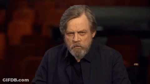 Man With Beard Making Funny Face In Dark Room GIF
