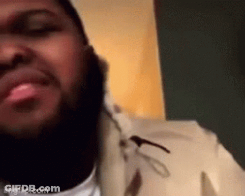 Man With Beard Making Funny Face On Phone GIF