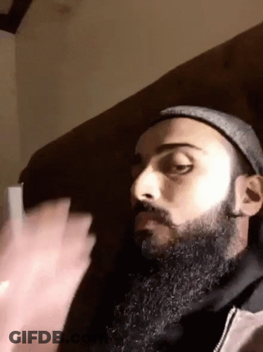Man With Beard Mustache Hat Sitting On Couch GIF