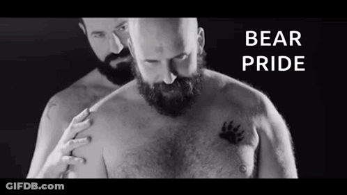 Man With Beard Next To Man With Bear Paw Tattoo GIF