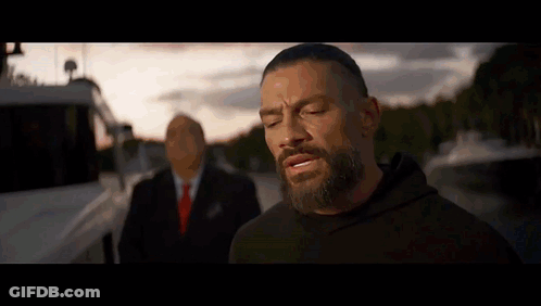 Man With Beard Next To Suit GIF
