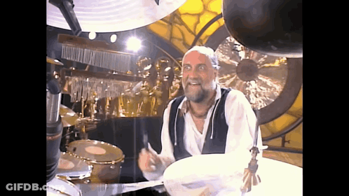 Man With Beard Playing Drums GIF
