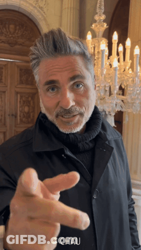 Man With Beard Pointing At Camera Saying Chau GIF