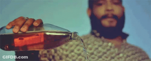 Man With Beard Pouring Soda Into Glass GIF