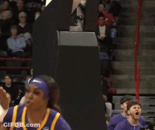 Man With Beard Riding Exercise Bike In Gym GIF