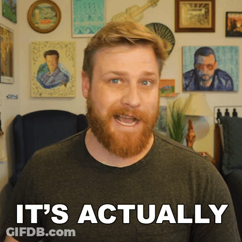 Man With Beard Saying It's Actually In Front Of Pictures GIF