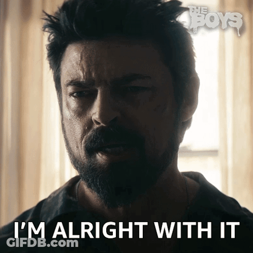 Man With Beard Says I'm Alright With It In Front Of Window GIF