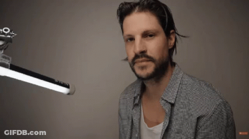 Man With Beard Says Kinda Gross In Front Of Light GIF