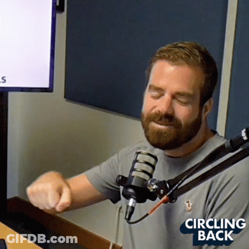 Man With Beard Sitting At Microphone GIF