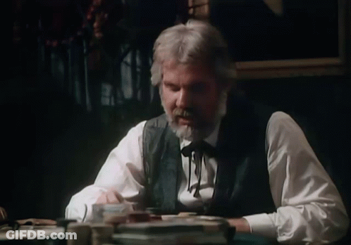 Man With Beard Sitting At Table GIF