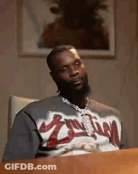 Man With Beard Sitting At Table GIF