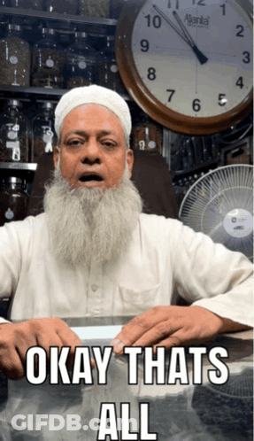 Man With Beard Sitting At Table GIF