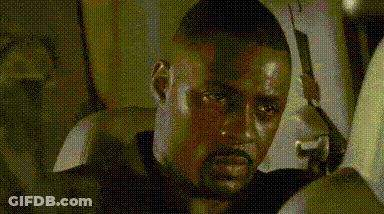 Man With Beard Sitting In Car Holding Gun GIF