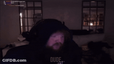 Man With Beard Sitting In Dark Room Saying My Stomach Hurting Right Now GIF