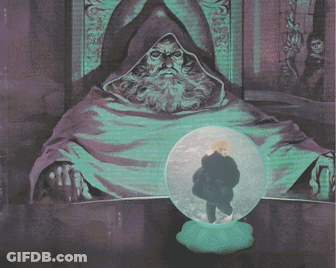 Man With Beard Sitting In Front Of Glass Ball GIF