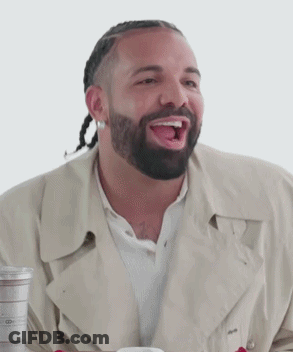 Man With Beard Sitting In Stadium Looking At Phone GIF