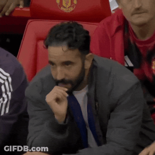 Man With Beard Sitting In Stadium Seat GIF