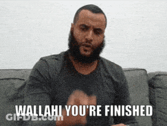 Man With Beard Sitting On Couch Says Wallahi You're Finished GIF