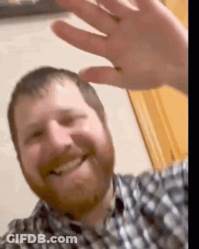 Man With Beard Smiling And Waving GIF