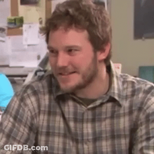 Man With Beard Smiling At Desk GIF