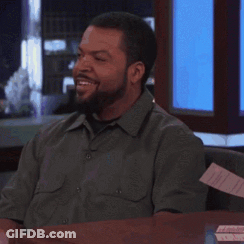 Man With Beard Smiling At Desk GIF