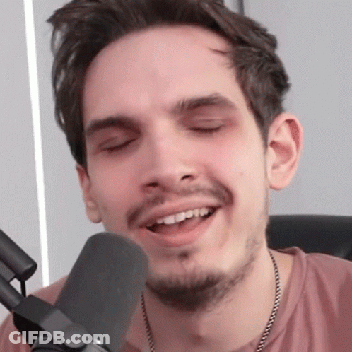 Man With Beard Smiling At Microphone GIF