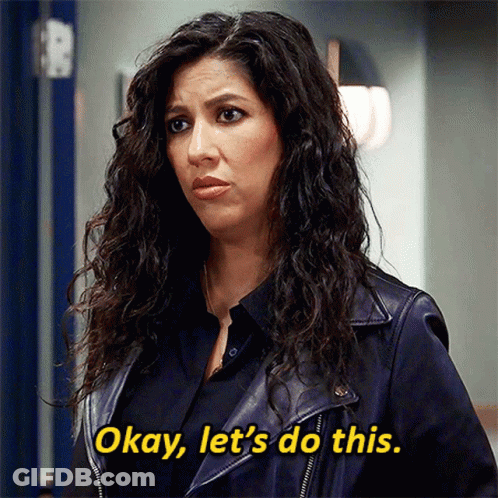 Man With Beard Smiling In Black Shirt At Door GIF