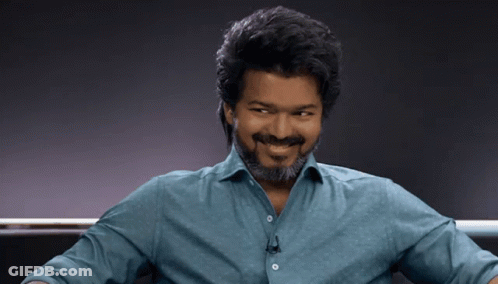Man With Beard Smiling In Blue Shirt GIF