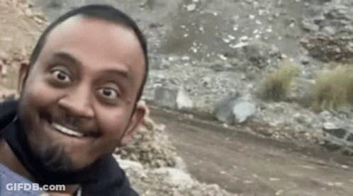 Man With Beard Smiling In Face Mask GIF