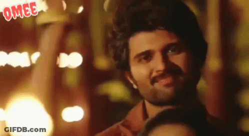 Man With Beard Smiling In Front Of Crowd GIF