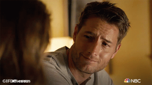 Man With Beard Smiling Next To Woman NBC Logo GIF