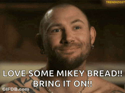 Man With Beard Smiling Saying Love Some Mikey Bread GIF