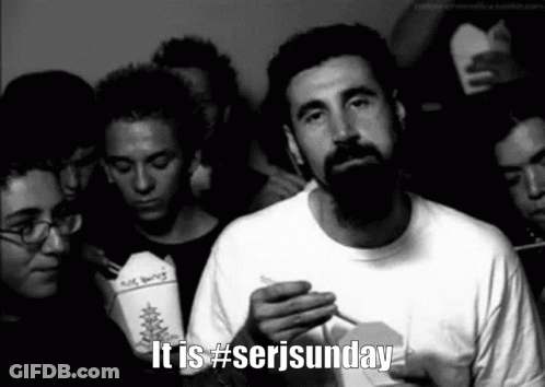 Man With Beard Smoking Cigarette In Crowd #Serjsunday GIF