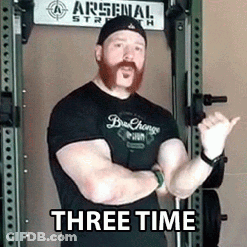 Man With Beard Standing Before Arsenal Strength Sign GIF