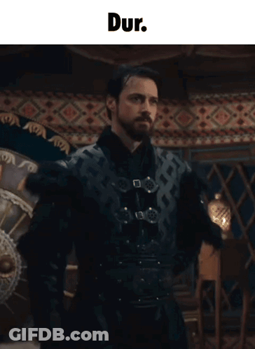 Man With Beard Standing Before Dur Sign GIF