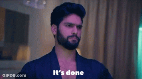 Man With Beard Standing Before Its Done Sign GIF