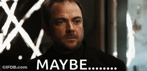 Man With Beard Standing Before Maybe Sign GIF