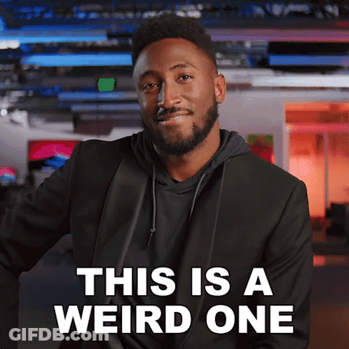 Man With Beard Standing Before Weird Sign GIF