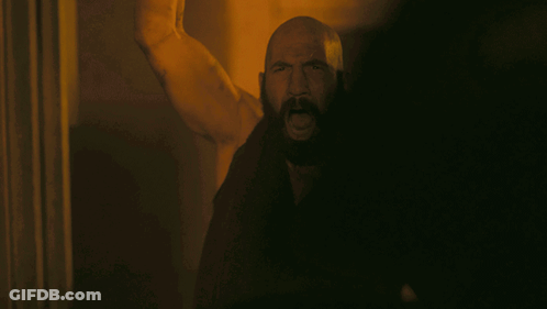 Man With Beard Standing In Dark GIF