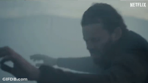 Man With Beard Standing In Foggy Room Arms Outstretched GIF